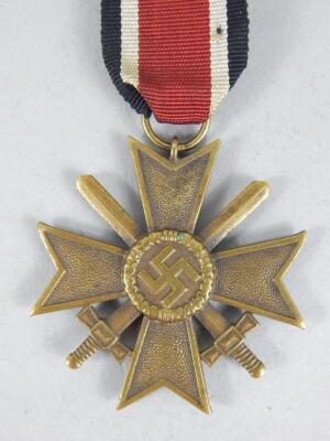 A Third Reich merit cross with swords medal - 2