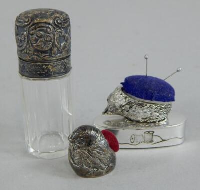 A collection of small silver and white metal