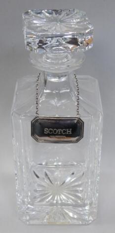 A cut glass decanter and stopper