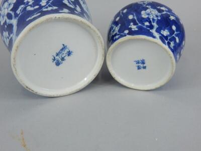 Two oriental prunus decorated porcelain jars and covers (AF) - 3