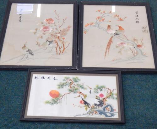 A pair of oriental silk embroidered pictures