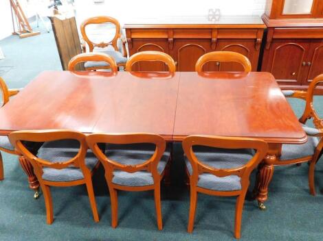 A Victorian style cherry extending dining table