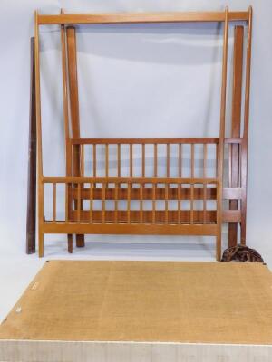 A mid to late 20thC teak framed retro design four poster bed
