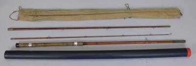 A three piece fibre glass fishing rod