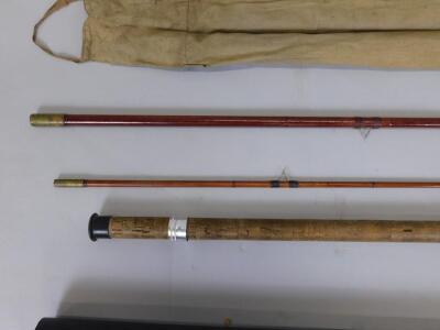 A three piece fibre glass fishing rod - 3