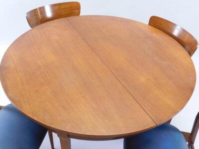 A 'G' plan type retro extending teak dining table and four chairs - 2