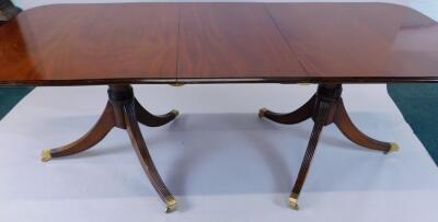 A mahogany extending D end dining table in Regency style