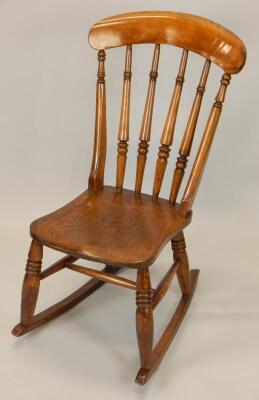 A late 19thC beech and elm rocking chair