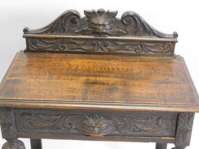 A late Victorian carved oak hall table - 2