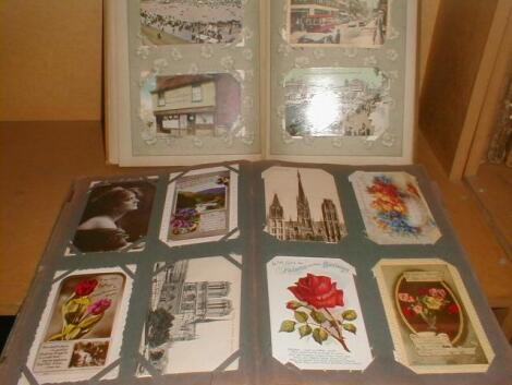 Two postcard albums £10-15