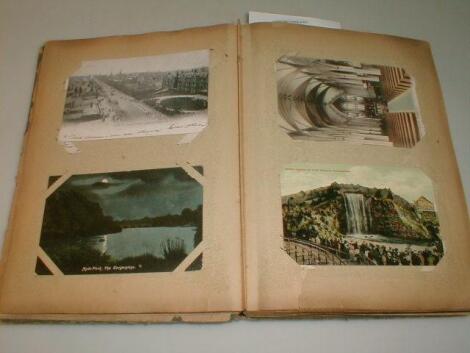 A cigarette card album and a postcard album