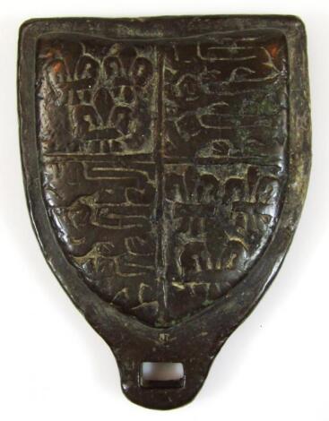 A rare and early bronze wool weight