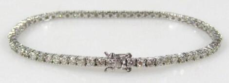 A diamond cut tennis bracelet