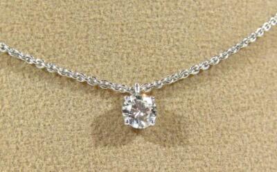 A single diamond set pendant