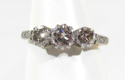 A ladies three stone diamond dress ring