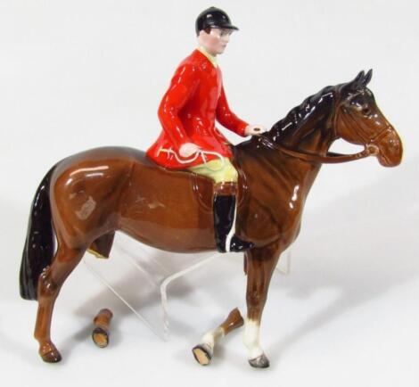 A Beswick red jacketed huntsman on brown horse