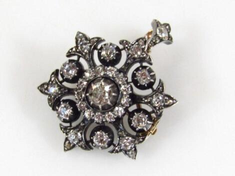 A Victorian star shaped diamond encrusted metamorphic pendant brooch