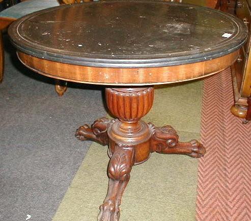 A 19thC Continental walnut centre table with a moulded black marble top