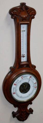 An early 20thC oak cased two dial banjo barometer and thermometer