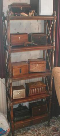 A Regency style mahogany open bookcase with "x" frame end supports