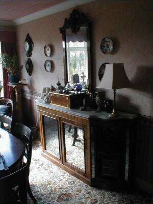 A Victorian walnut credenza with a white moulded marble top