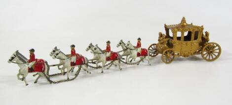 A mid 20thC toy Coronation coach led by horses