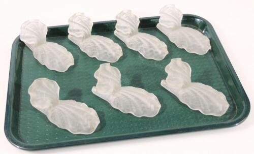 A set of seven frosted glass shells