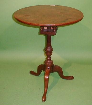 A George III mahogany supper table with circular tilt top resting on later bird cage