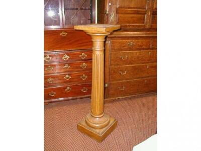 A Victorian grain painted pine pedestal of fluted form with square top and base