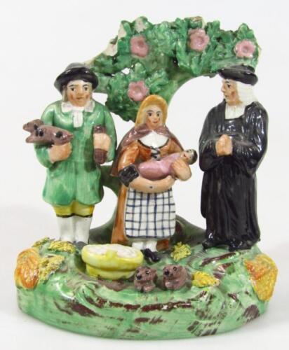 A 19thC Staffordshire Tythe Pig pottery figure group