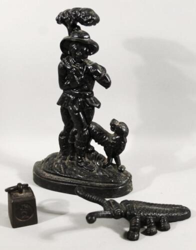 A 19thC cast iron door stop