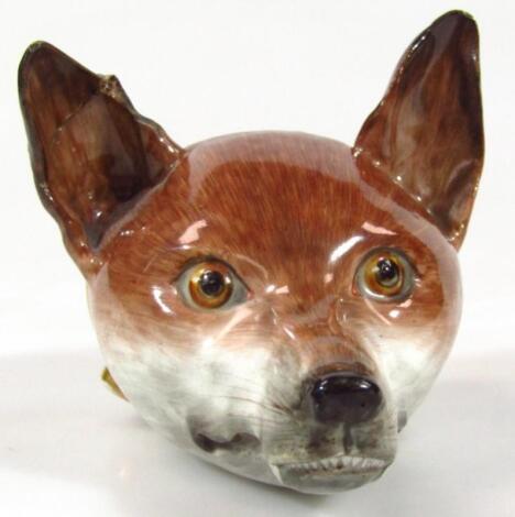 An early 19thC porcelain fox head Tally Ho stirrup cup