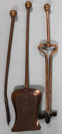 An early 20thC Arts and Crafts copper fireside companion set