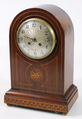 An early 20thC mahogany domed cased mantel clock