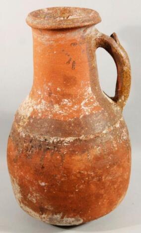 A unglazed redware Roman style flagon