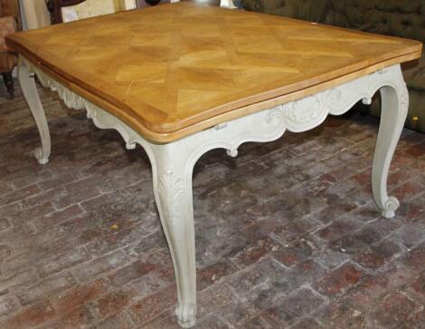 A 20thC French extending dining table