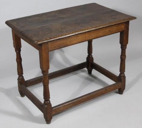 An 18thC oak plank top side table