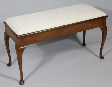 A 20thC walnut duet stool