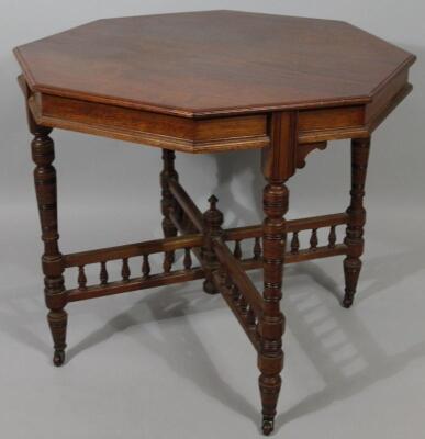 An Edwardian walnut stained occasional table