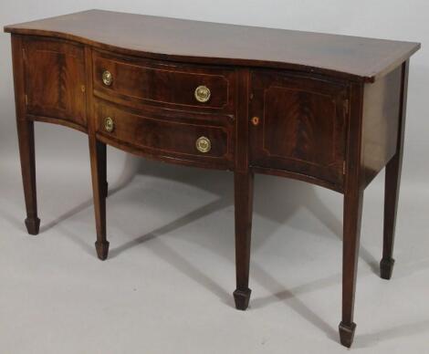 A George III style mahogany serpentine sideboard