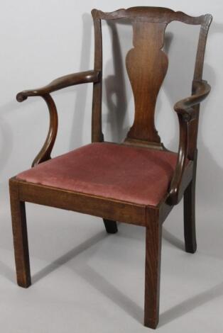 An early 19thC Chippendale design oak framed carver chair