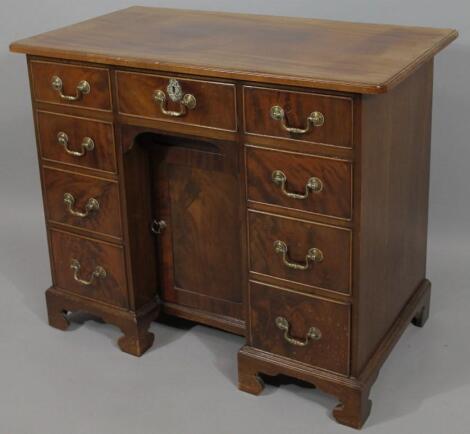 A 19thC mahogany knee hole dressing table or desk