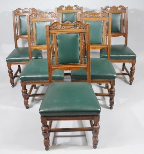 A set of six late Victorian oak framed library style dining chairs