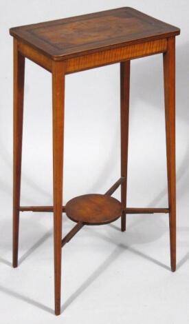 An Edwardian mahogany and satinwood inlaid occasional table