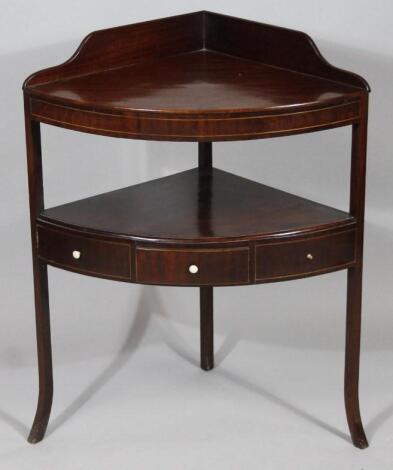 A George III mahogany corner washstand