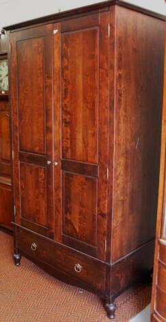 A modern stained hardwood hall style wardrobe