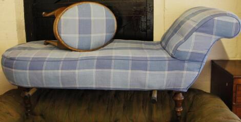 A late Victorian stained walnut framed chaise longue