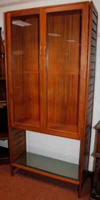 A modern teak display cabinet