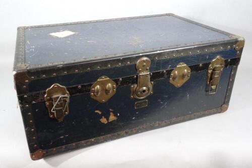 An early to mid 20thC pressed leather and metal bound sea chest