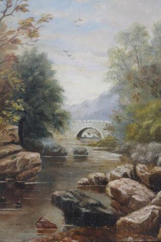 M (19thC English School). River Landscape with bridge and mountains in the distance with clouds gat